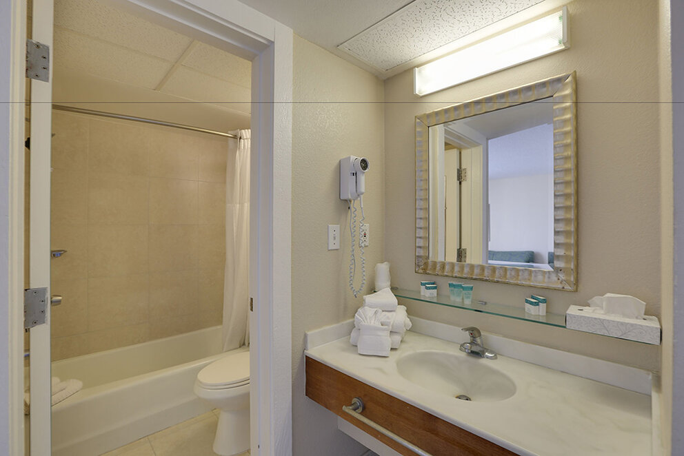 a bathroom with a mirror and sink