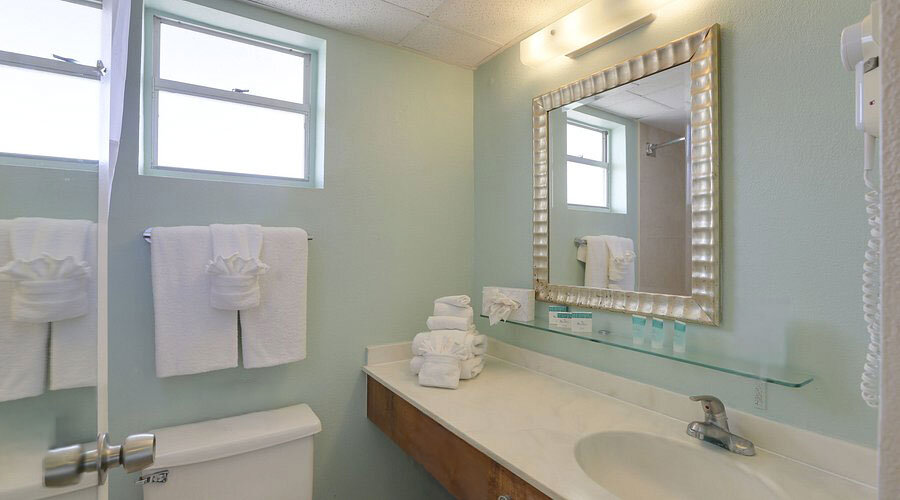 a bathroom with a mirror and a sink