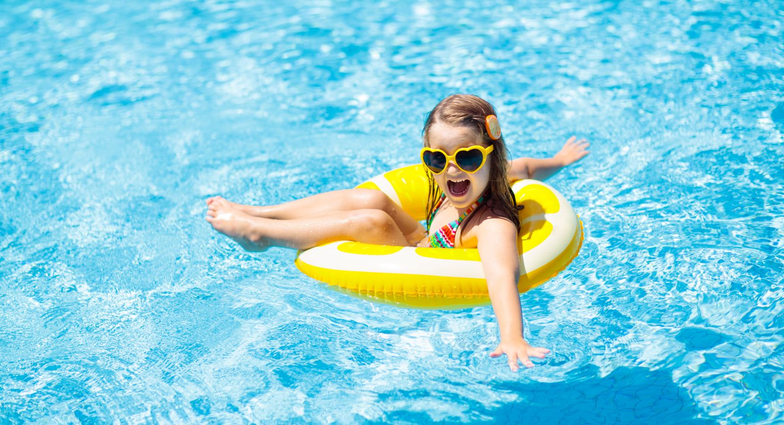 girl in pool floatie